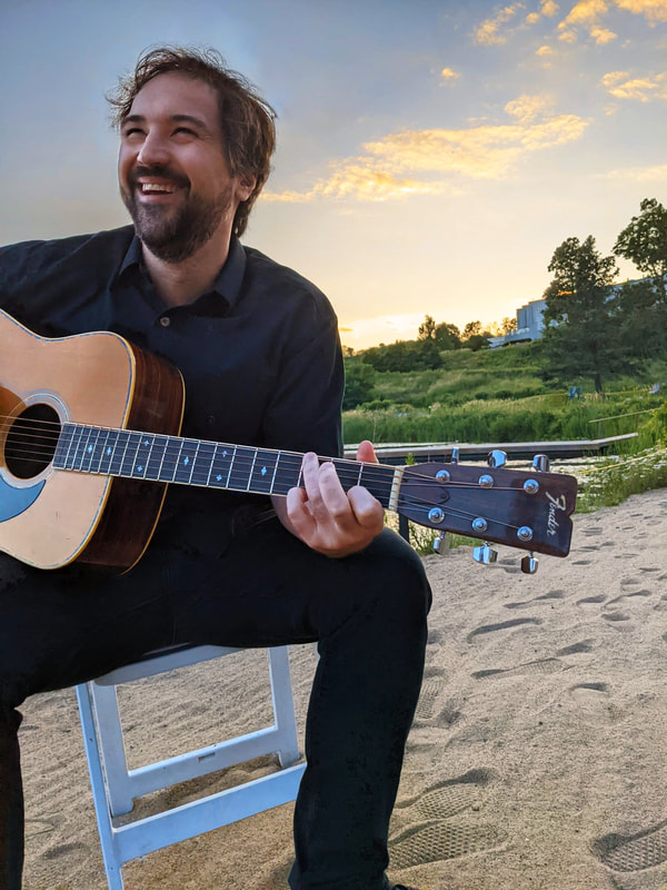 Collin playing guitar